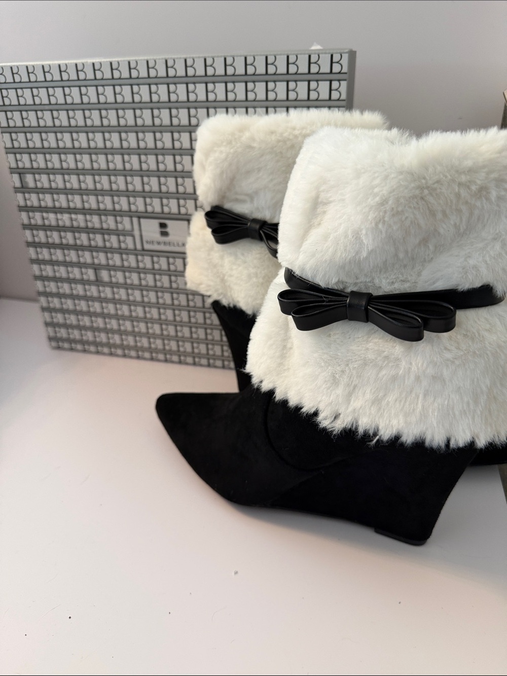Black Newbella Suede Wedge Booties with White Faux-Fur Cuff, and Black Bow